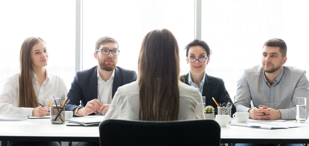 Group of People Interviewing Someone