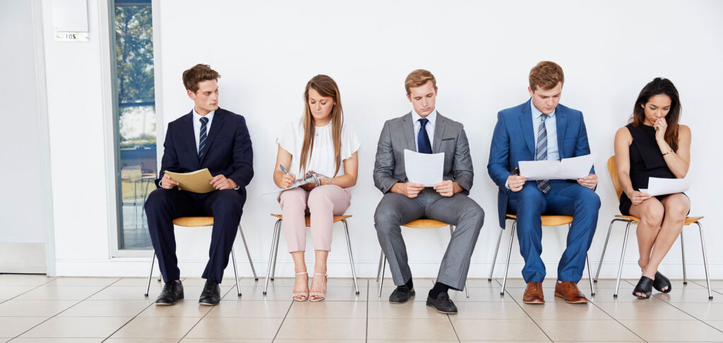 Group of People Sitting and Waiting for Interview