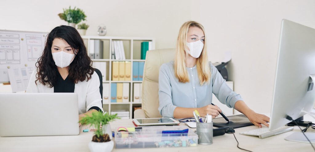 People Working in an Office with Masks