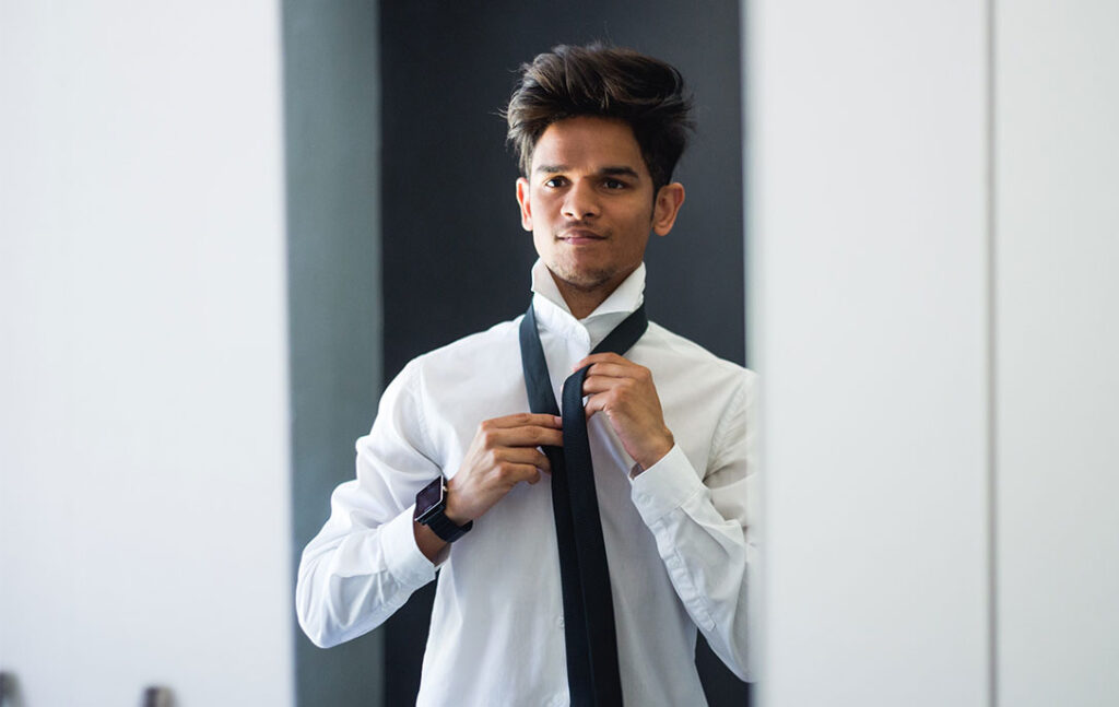 Person Putting on a Tie