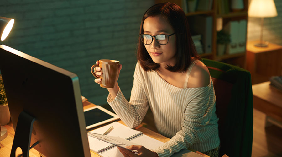 Person Sitting at Desk in Home