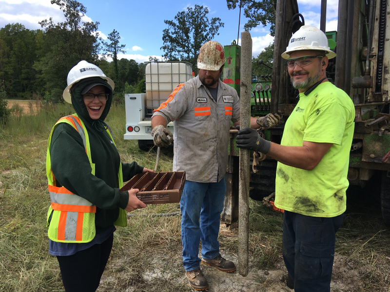 Employees Collecting Core Samples Through Drilling