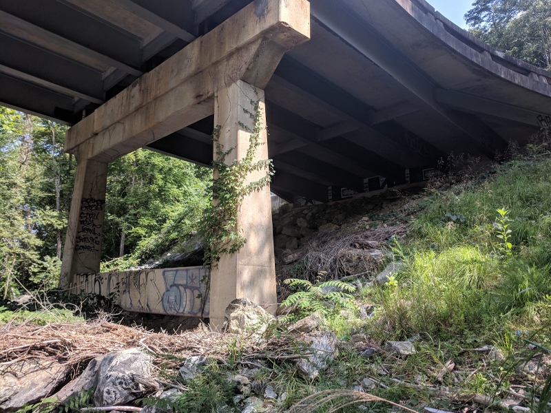 B-5992 Bridge over French Broad River depicting the connection between the bridge and the supports as well as the land.