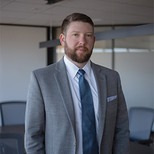 Waist-up professional photo of Ben Wallus.