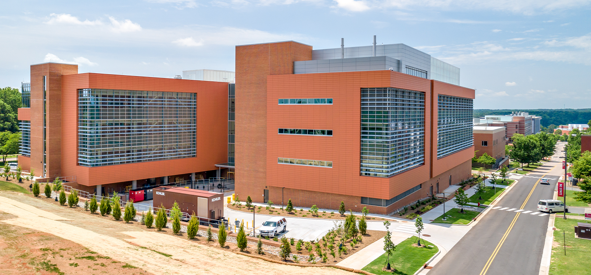 NCSU Plant Sciences Building from an angle featuring the back parking lot.