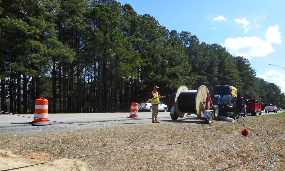 Fiber cable installation for I-95 construction project.