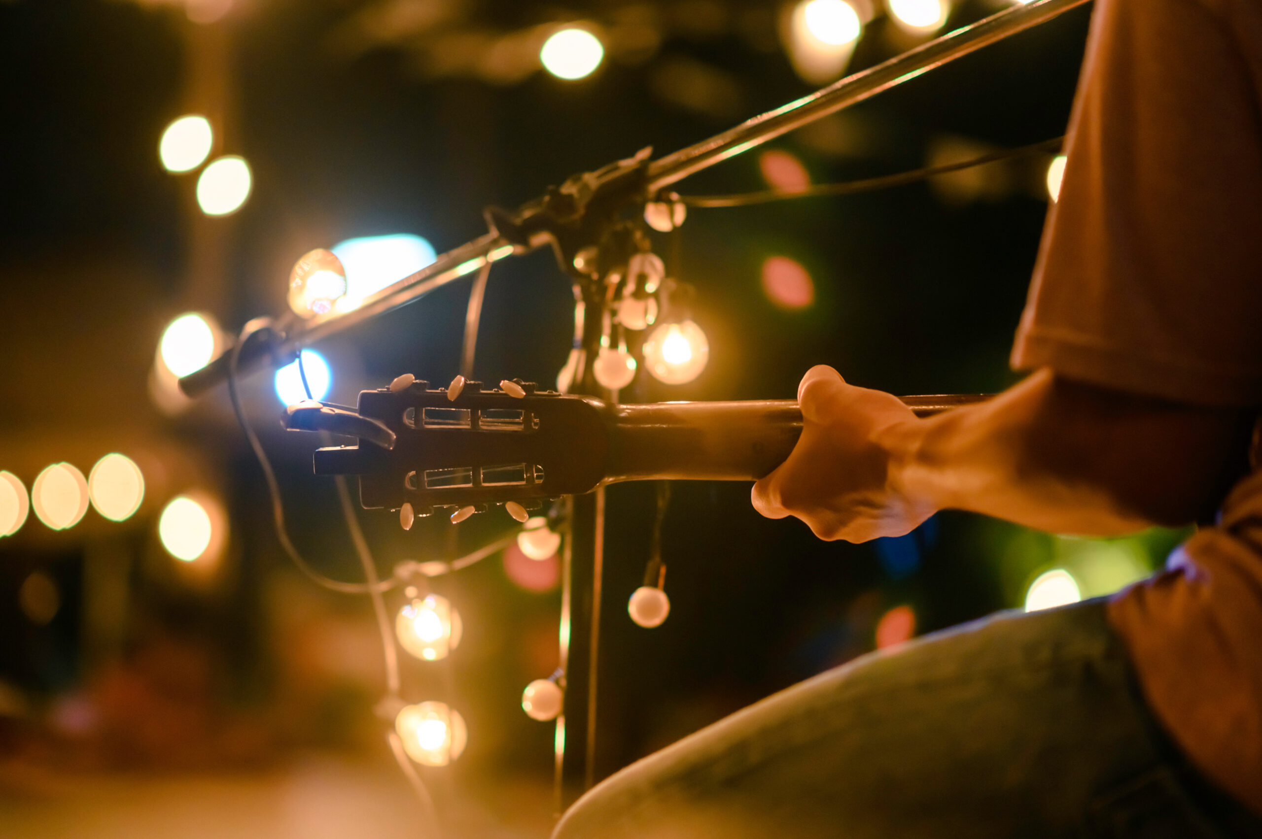 Stock image of a man playing guitar.