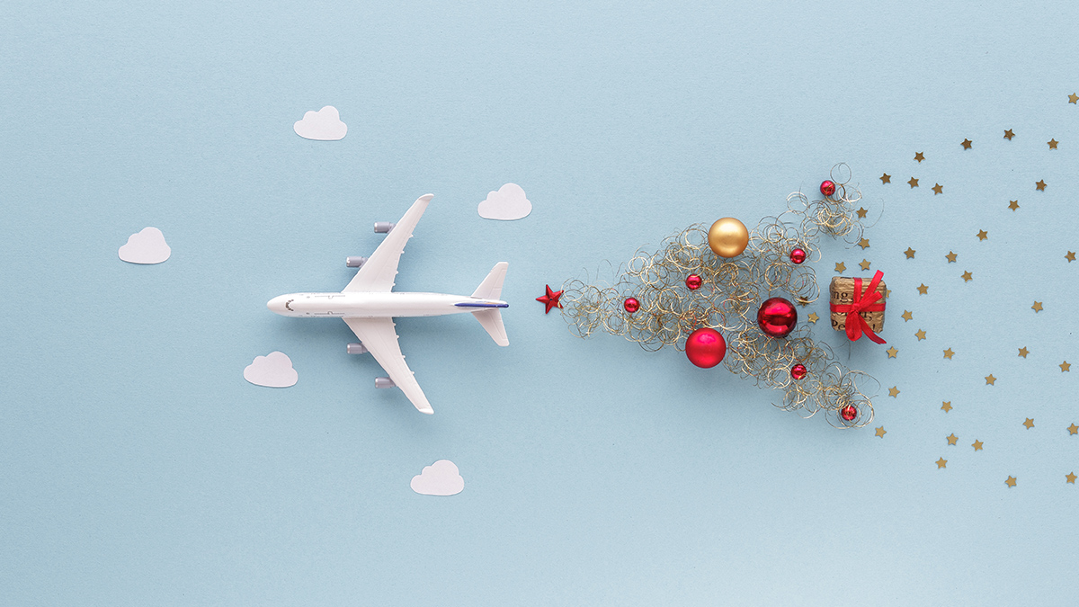 Fake airplane flying with Christmas tree behind it