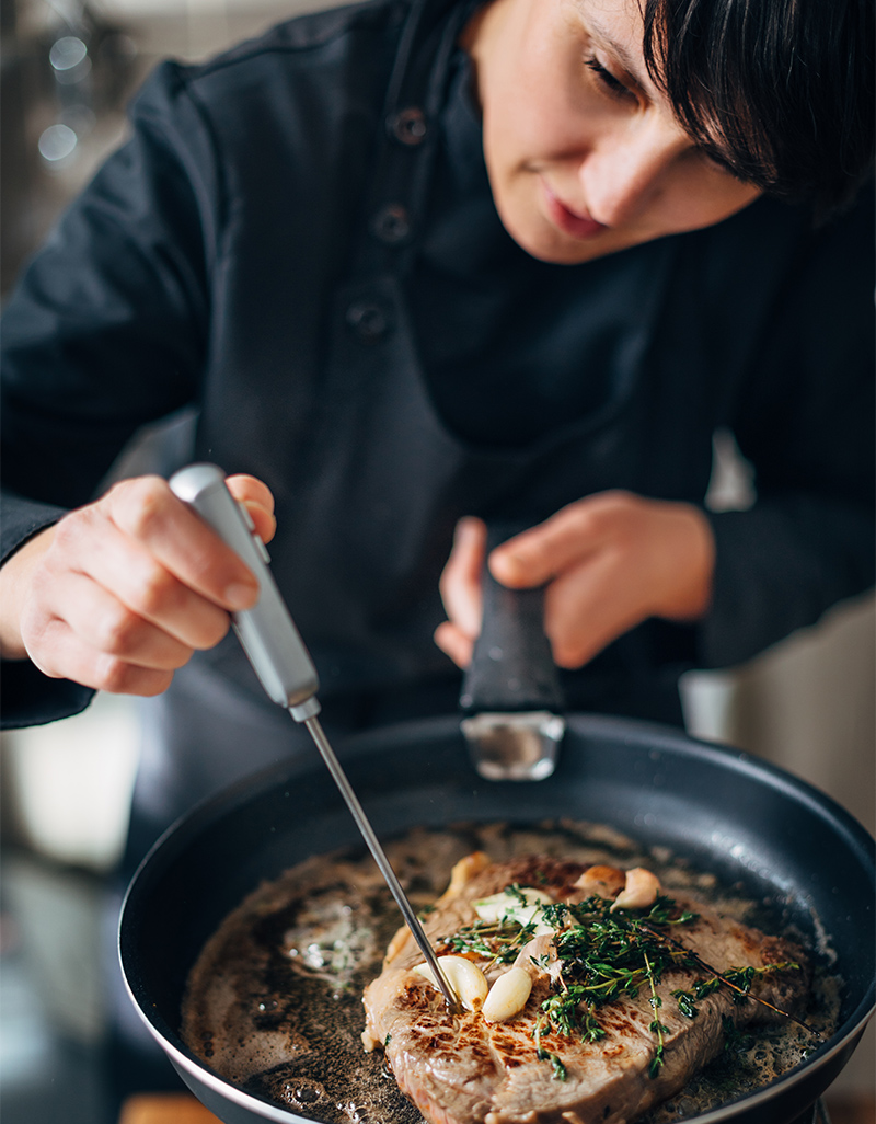 Woman checking temp of food