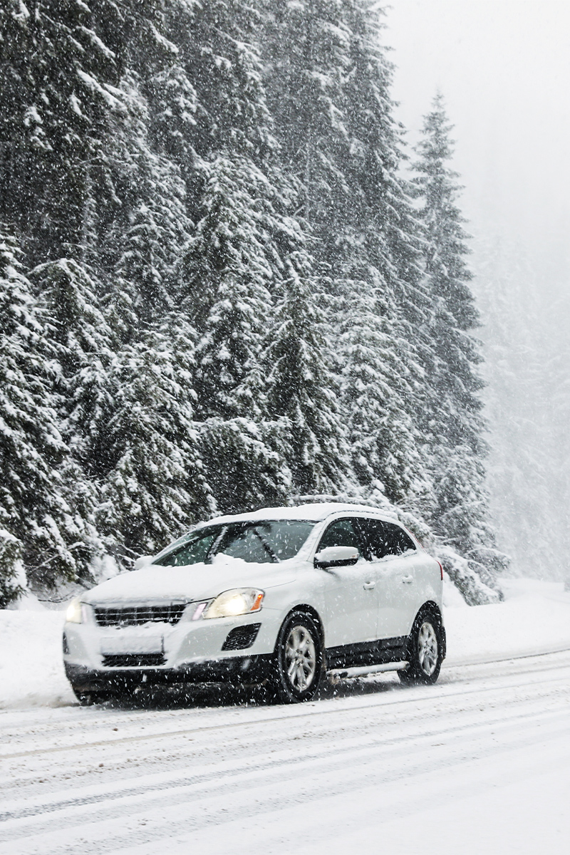 Car driving on a snowy road