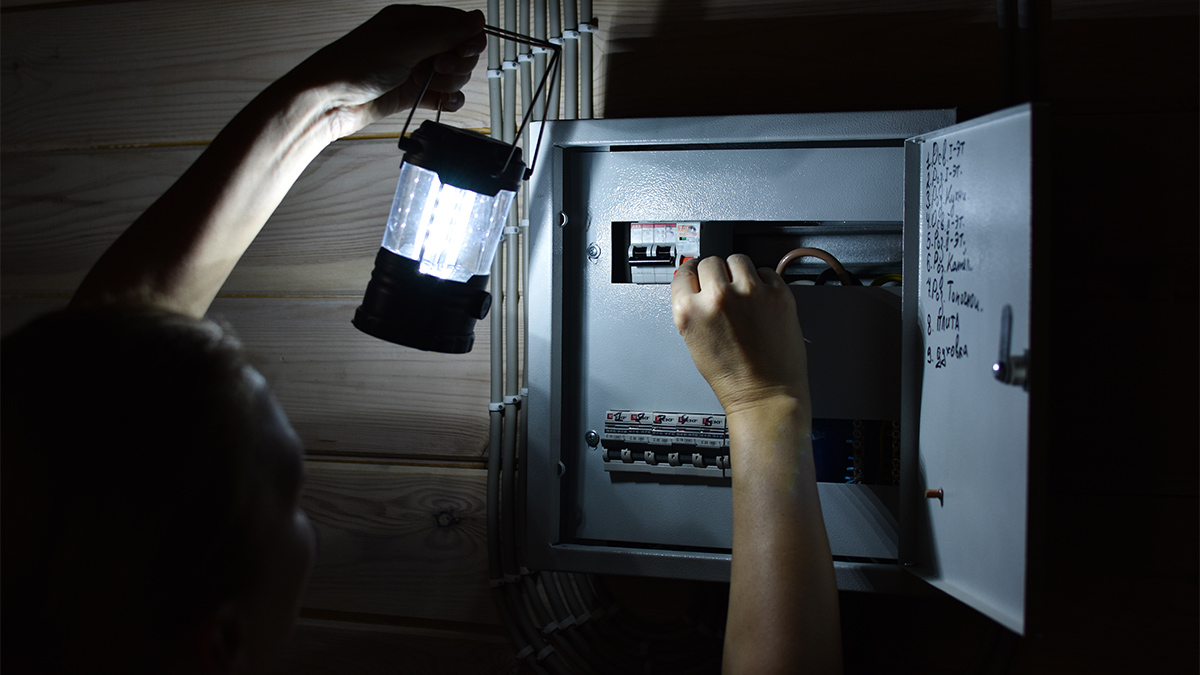 Person checking the electrical panel