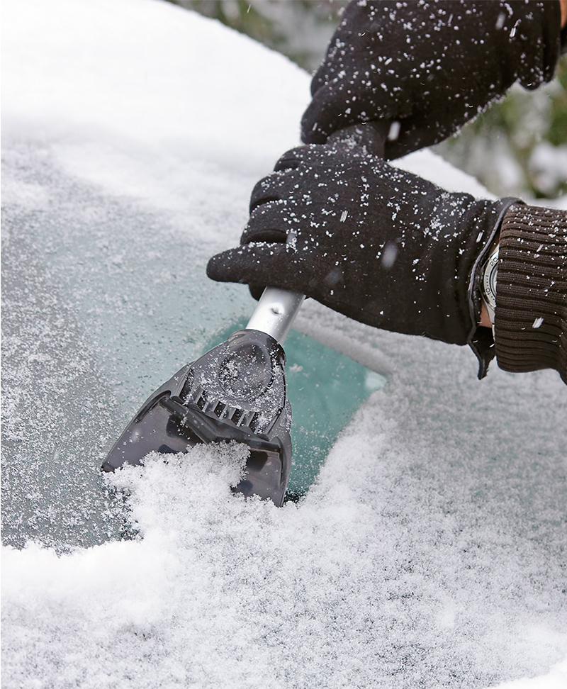 Scraping ice off of a windshield